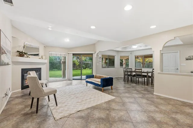 a view of a livingroom with furniture window and wooden floor