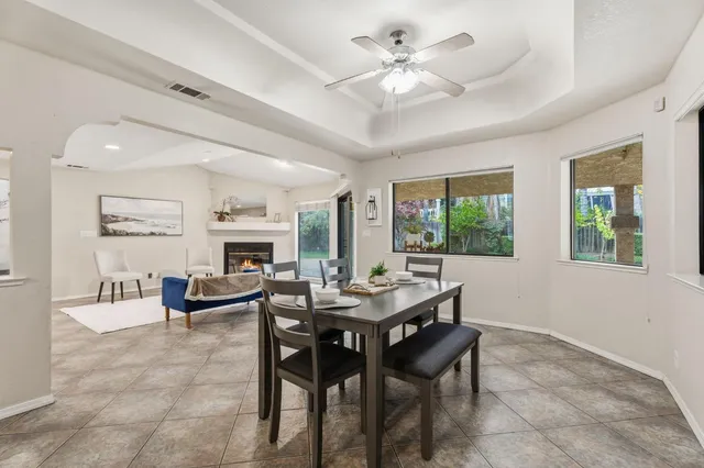 a kitchen with white cabinets a sink and dishwasher
