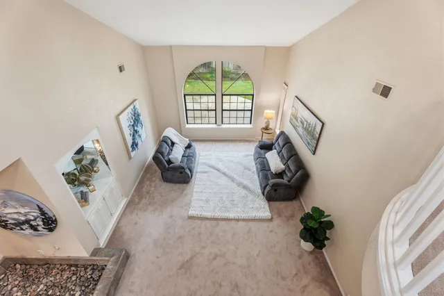 a bathroom with a double vanity sink mirror and toilet
