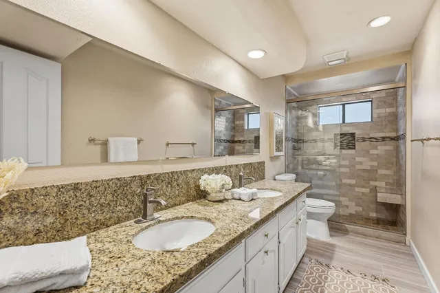 a bathroom with a bathtub and shower