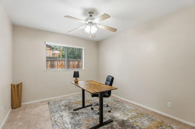 a hallway with sink and mirror
