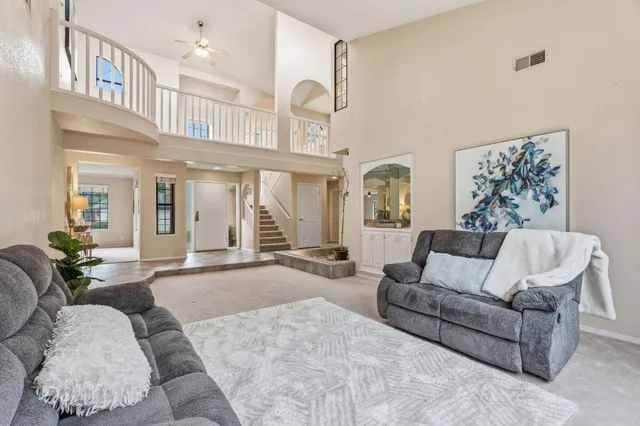 a view of a dining room with furniture and a table