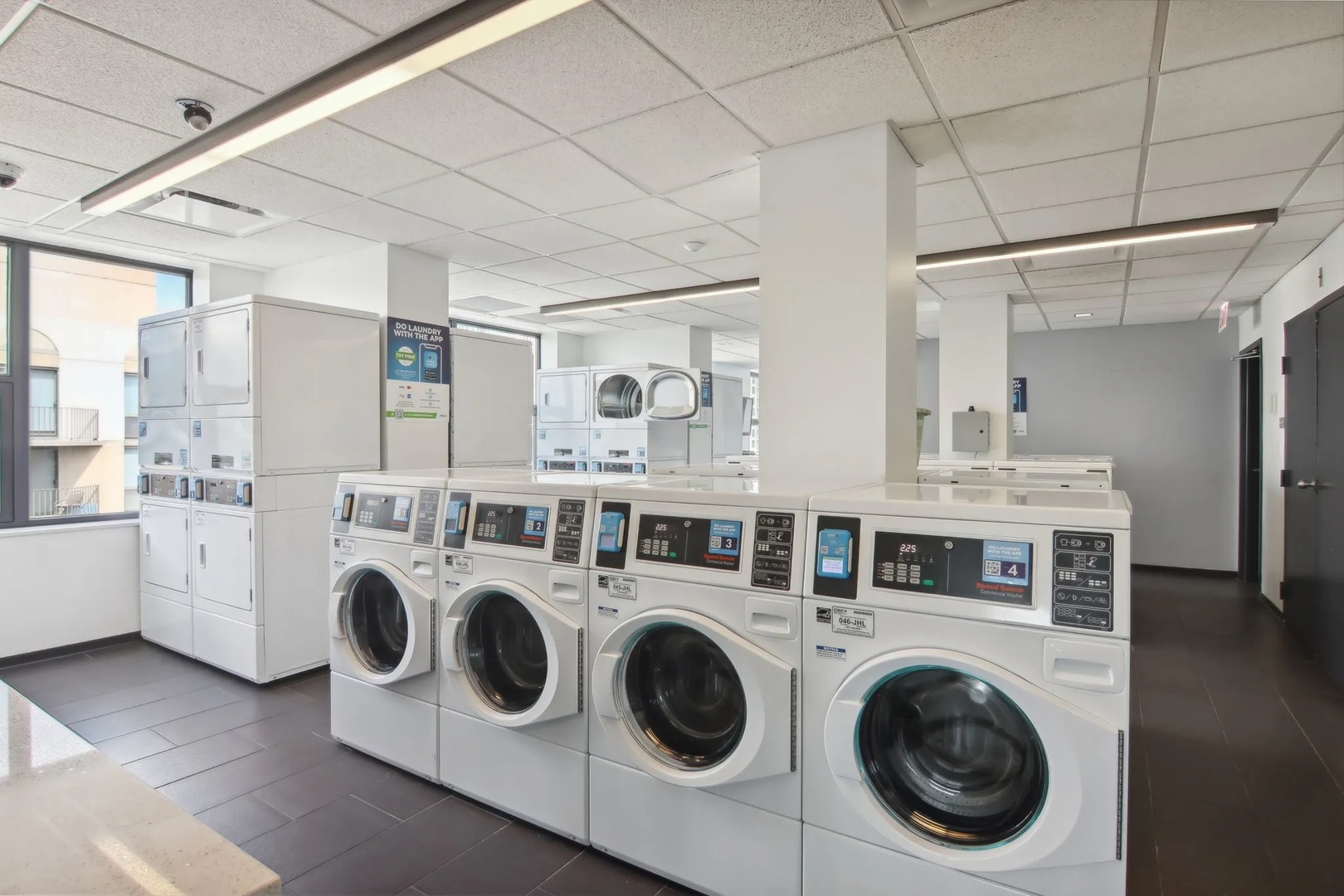 77 West Huron Street, Unit 1803 Chicago, IL 60654 - Photo 11 of 22 a utility room with dryer and washer