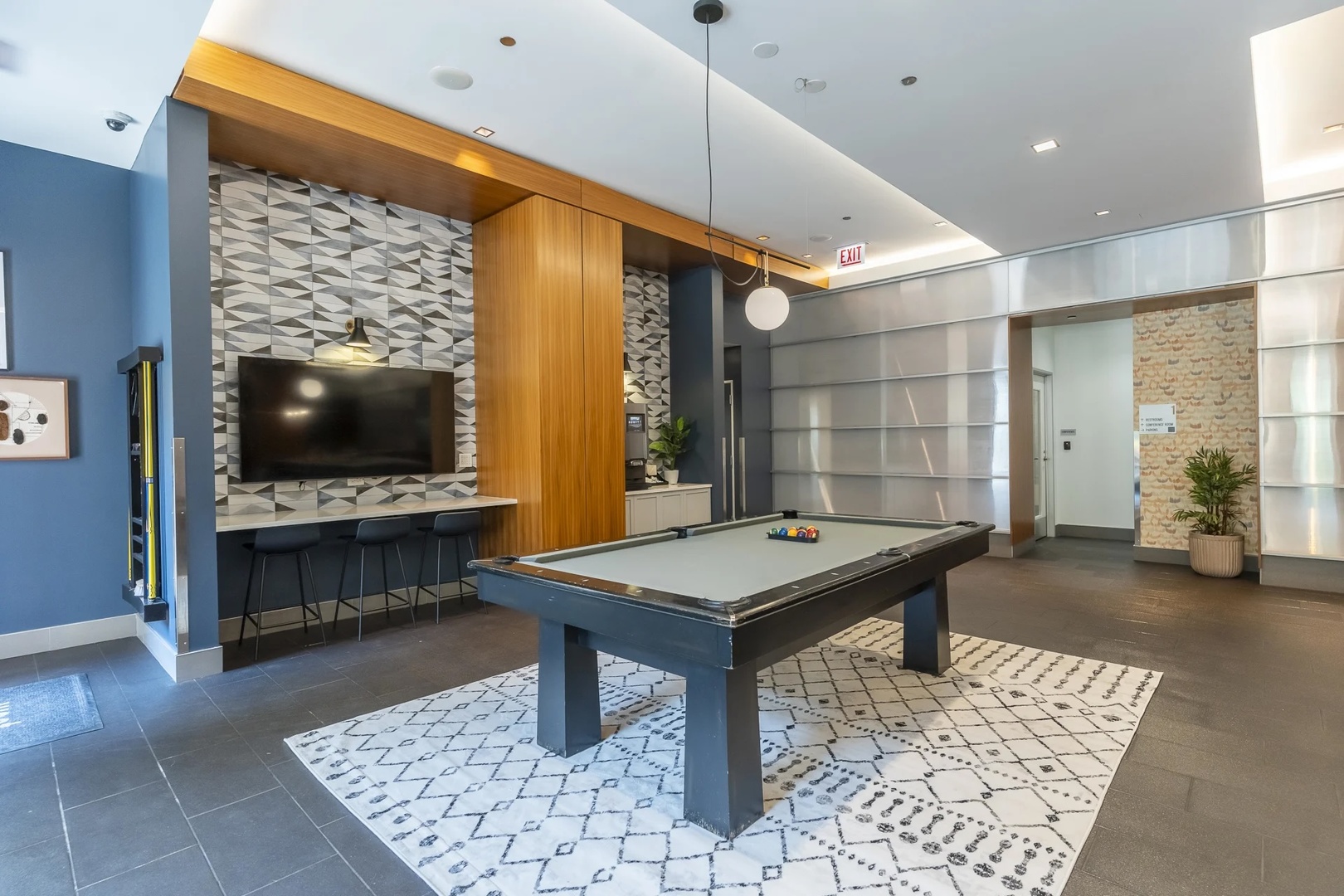 77 West Huron Street, Unit 1803 Chicago, IL 60654 - Photo 18 of 22 a living room with furniture and a flat screen tv