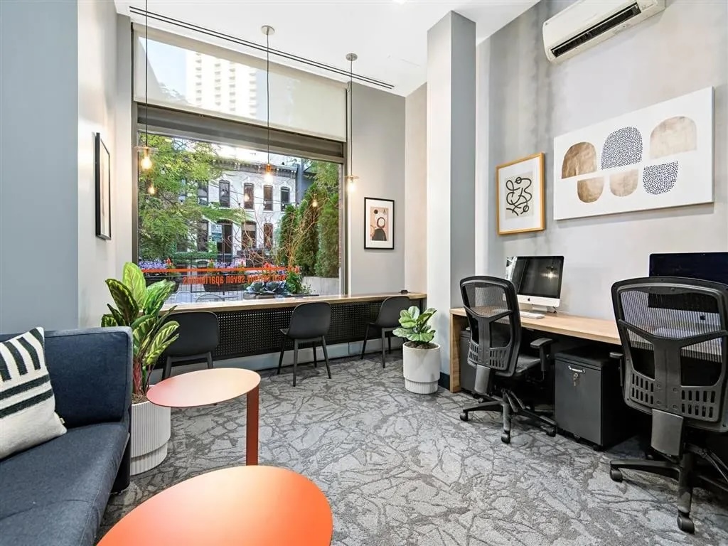 77 West Huron Street, Unit 1803 Chicago, IL 60654 - Photo 19 of 22 a living room with furniture a rug and a large window