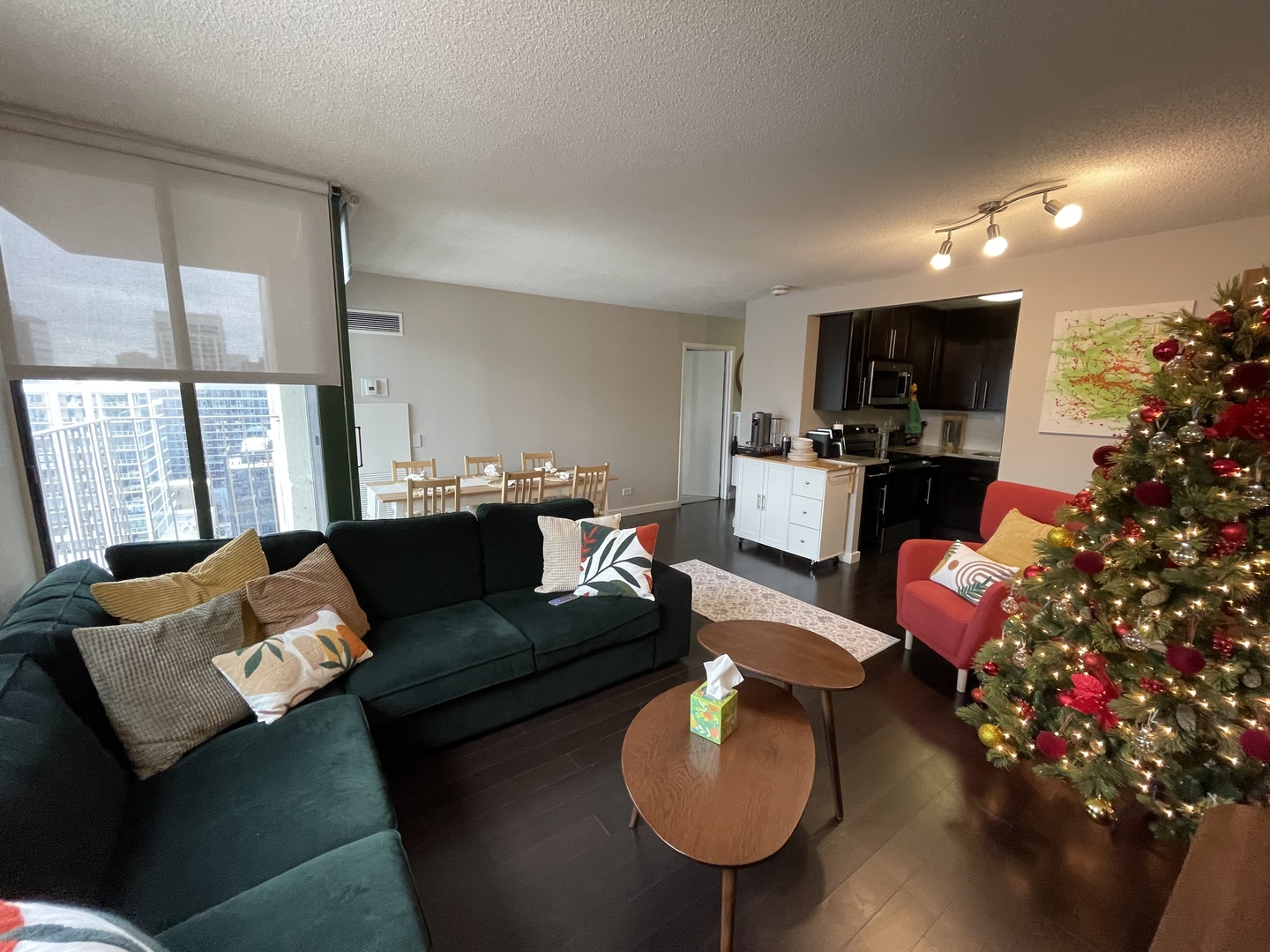77 West Huron Street, Unit 1803 Chicago, IL 60654 - Photo 3 of 22 a living room with furniture and a flat screen tv
