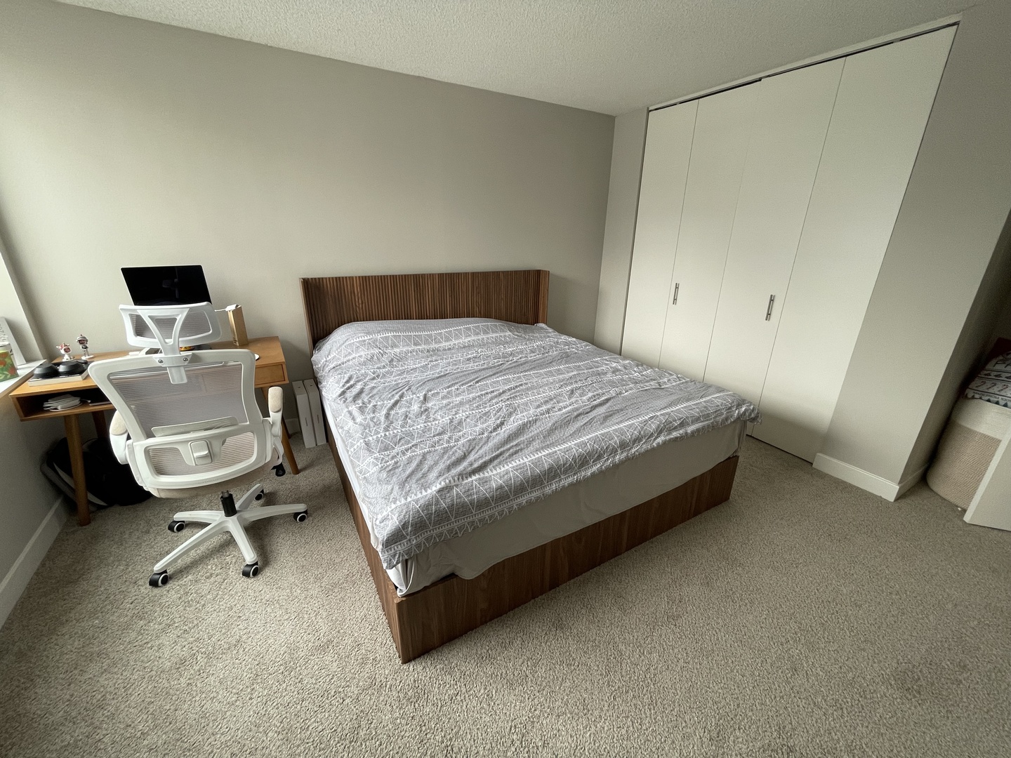 77 West Huron Street, Unit 1803 Chicago, IL 60654 - Photo 6 of 22 a bedroom with a bed and a chair in it