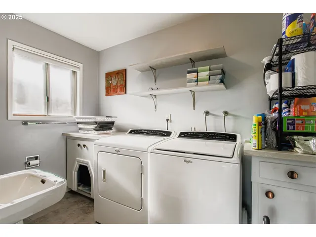 a utility room with closet dryer and washer