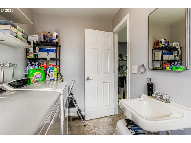 a bathroom with a sink a vanity and a mirror