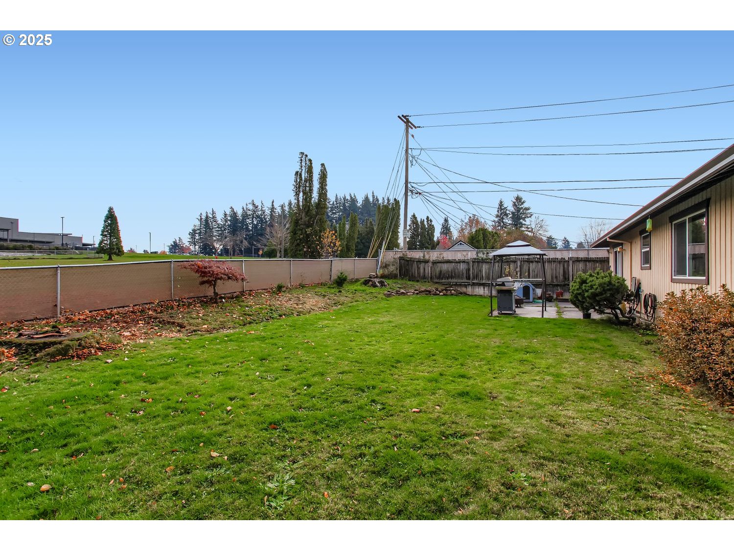 830 Southeast 214th Avenue Gresham, OR 97030 - Photo 29 of 30 a view of a house with a yard and sitting area