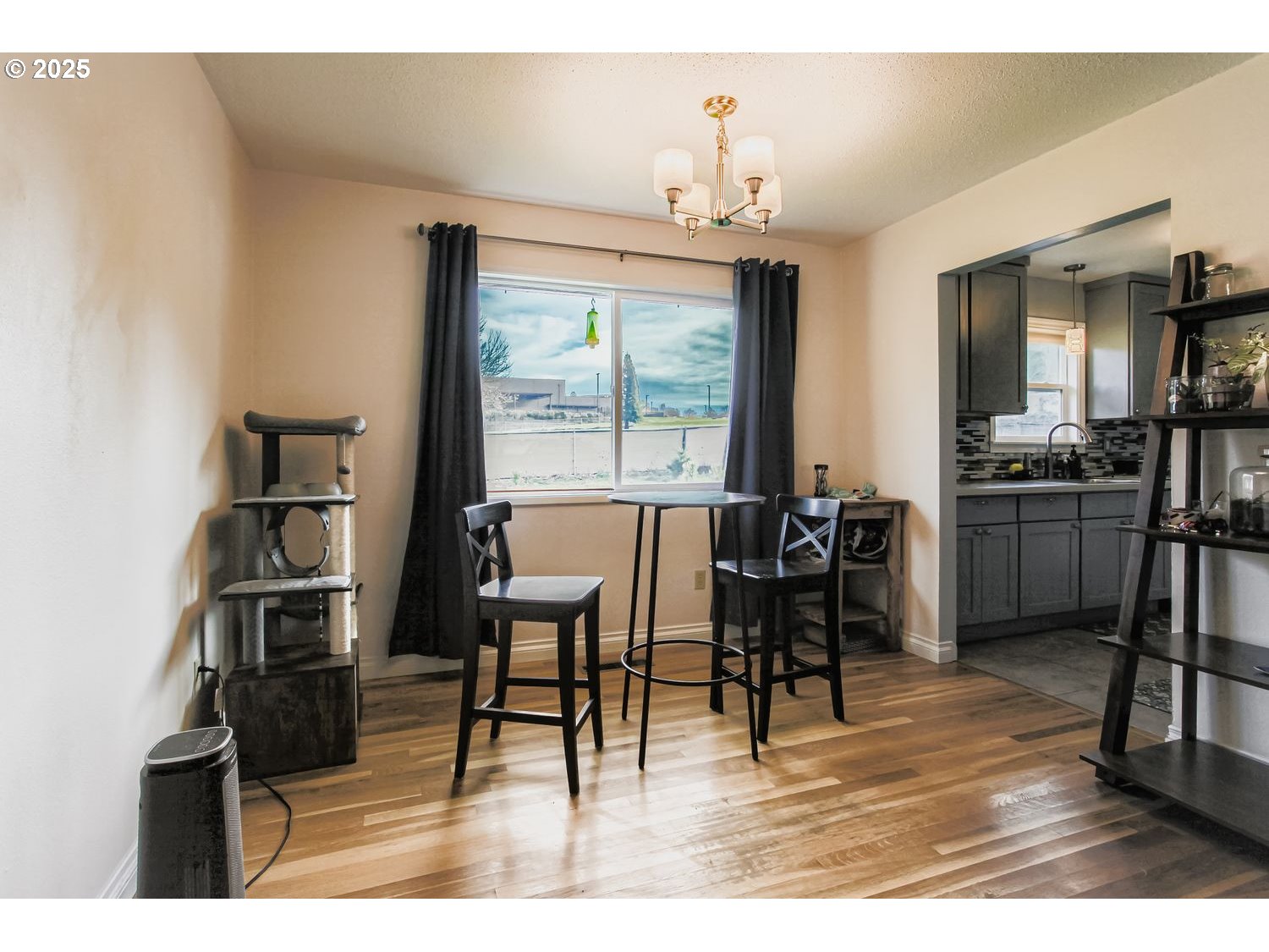 830 Southeast 214th Avenue Gresham, OR 97030 - Photo 10 of 30 a view of a dining room with furniture and a chandelier
