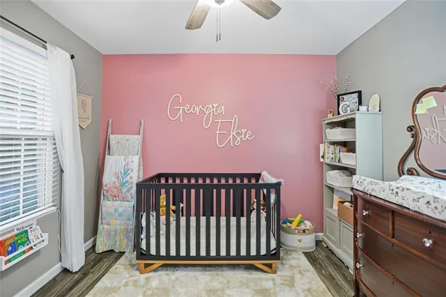 a bedroom with furniture and a window