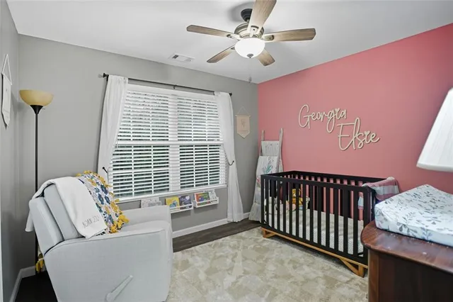 a bedroom with furniture and a window