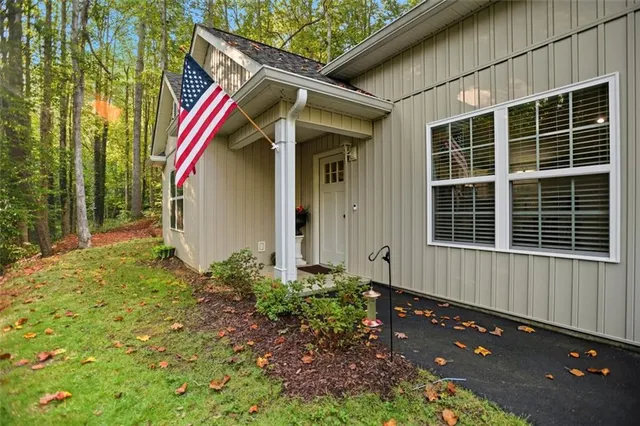 a view of house with backyard