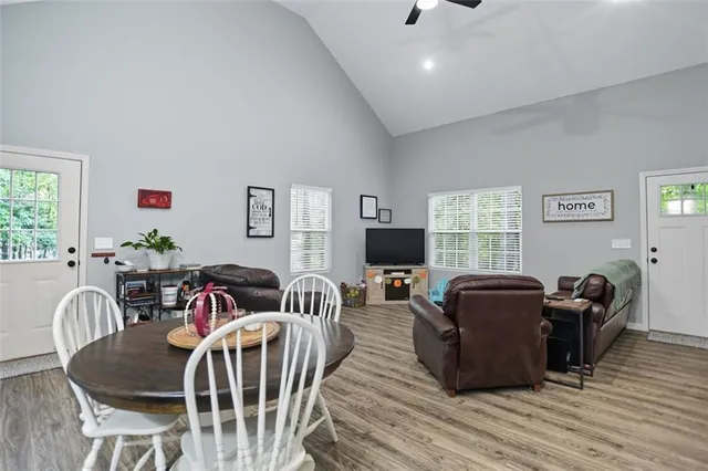 a view of a livingroom with furniture window and wooden floor