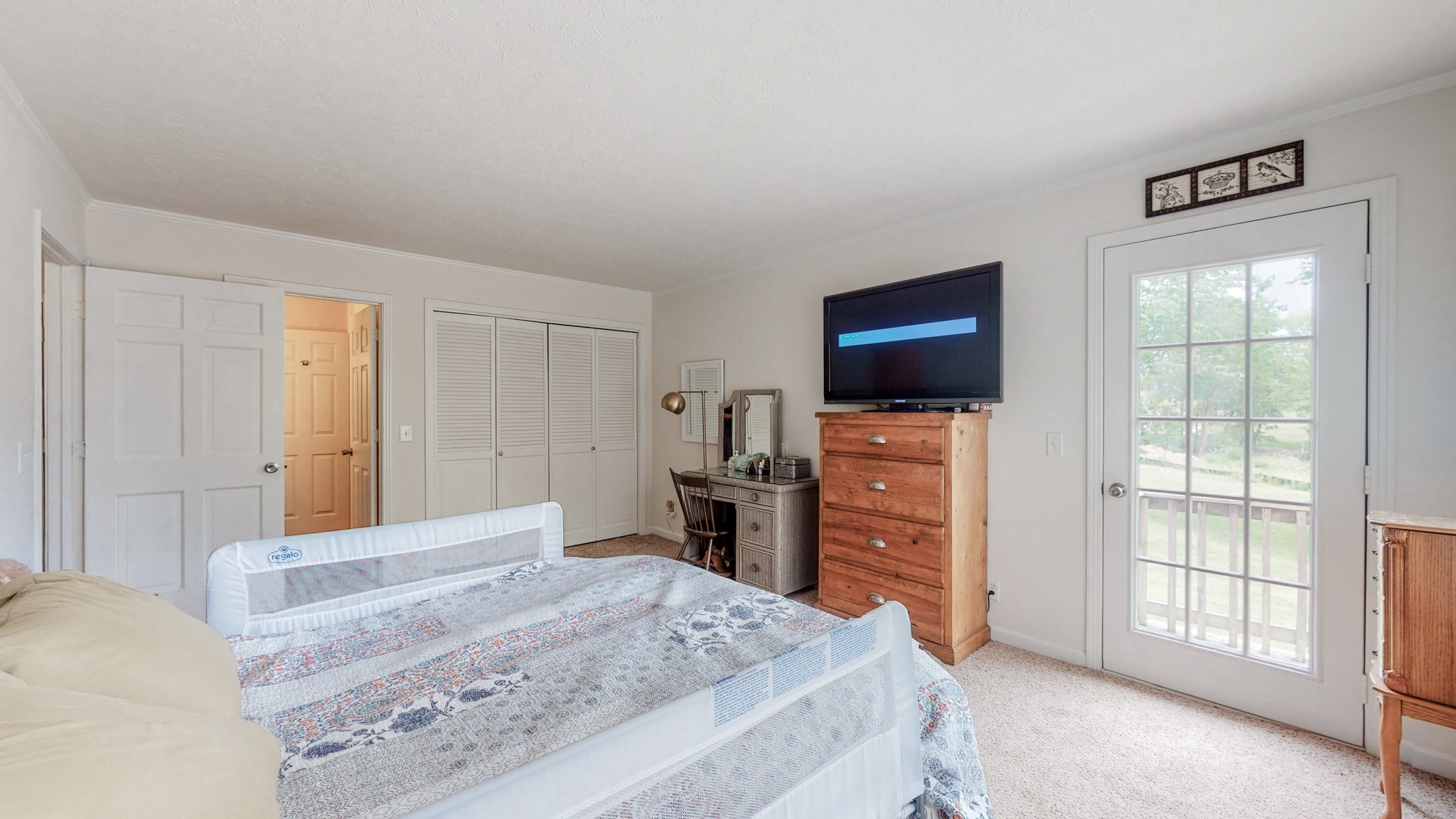 211 Old Horn Springs Road Lebanon, TN 37087 - Photo 16 of 43 a bedroom with a bed and a flat screen tv