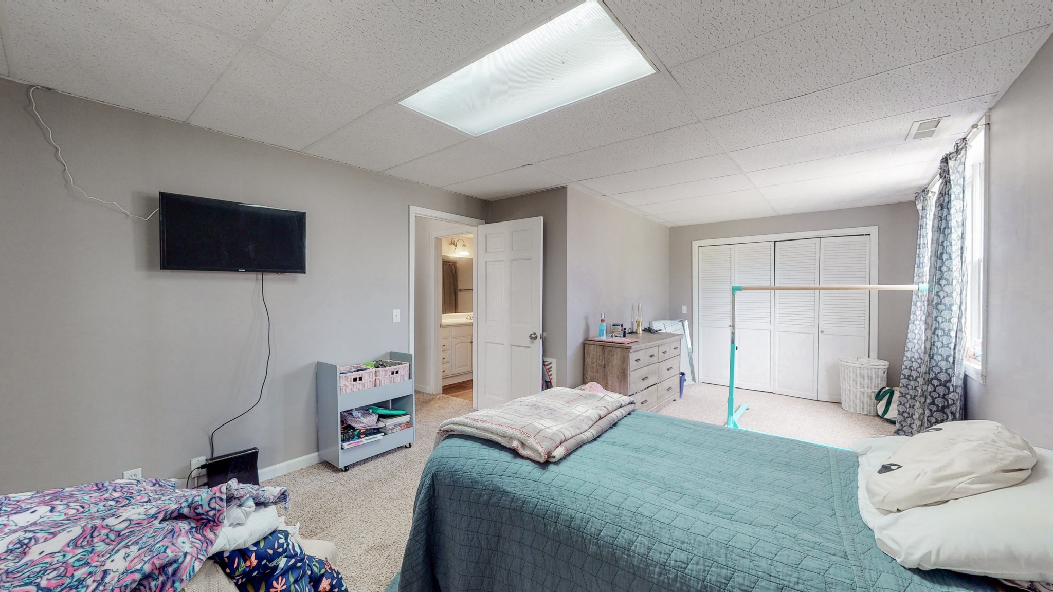 211 Old Horn Springs Road Lebanon, TN 37087 - Photo 25 of 43 a bedroom with a bed and a flat screen tv