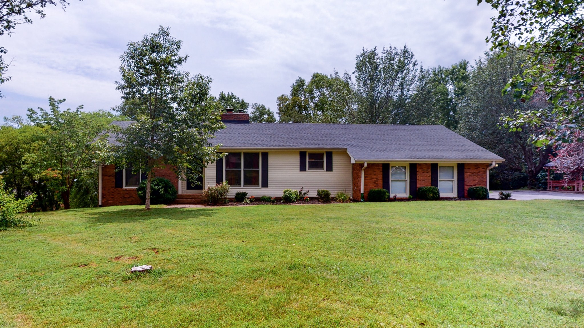 211 Old Horn Springs Road Lebanon, TN 37087 - Photo 5 of 43 a front view of a house with a garden