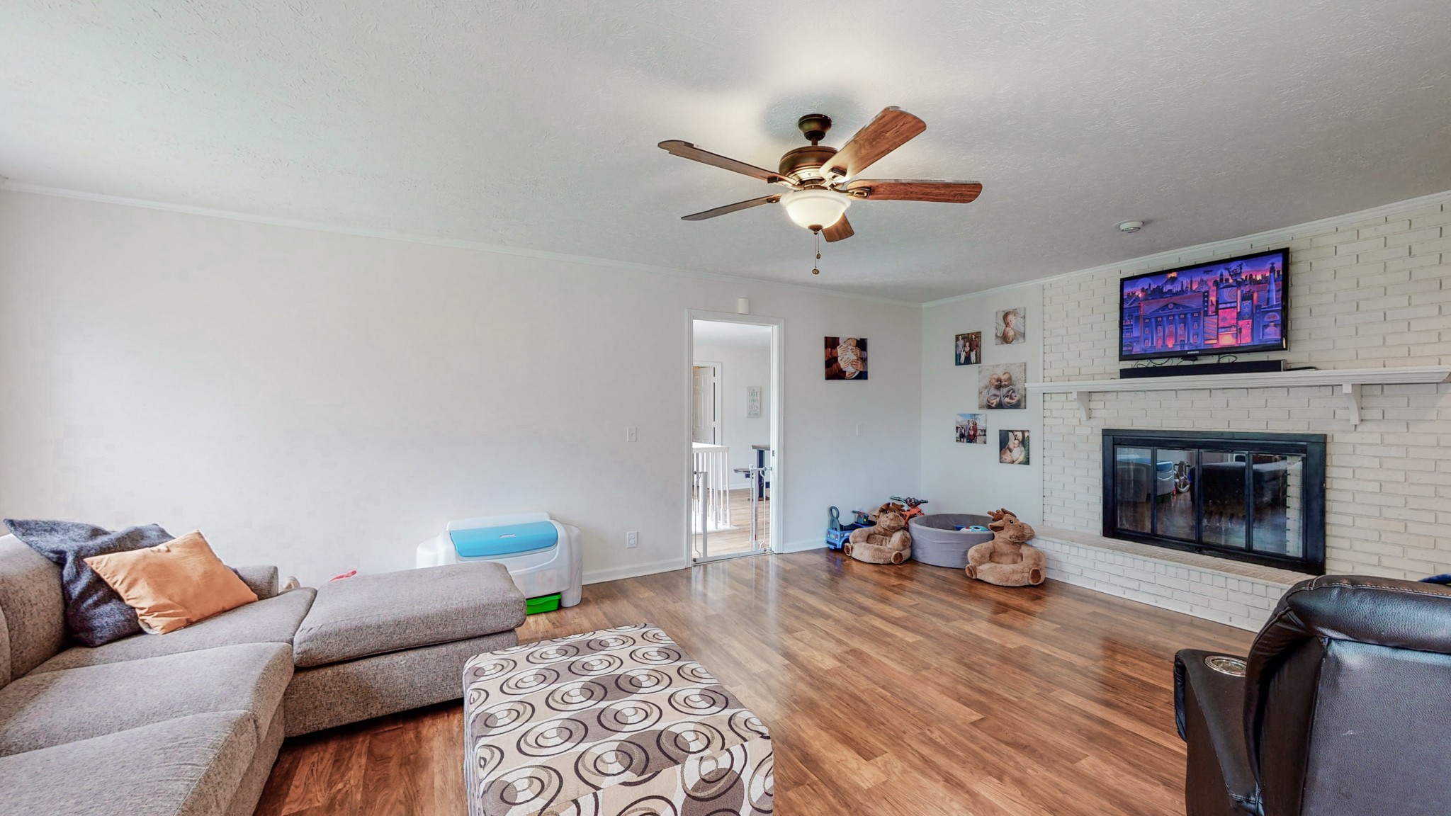 211 Old Horn Springs Road Lebanon, TN 37087 - Photo 7 of 43 a bedroom with furniture and a fireplace
