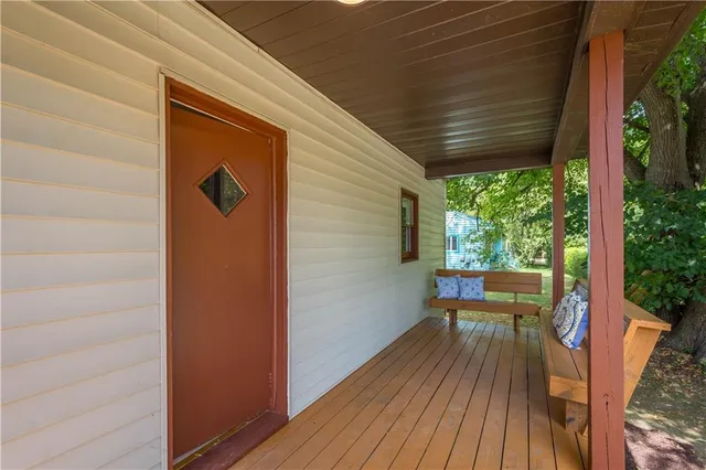a balcony with wooden floor
