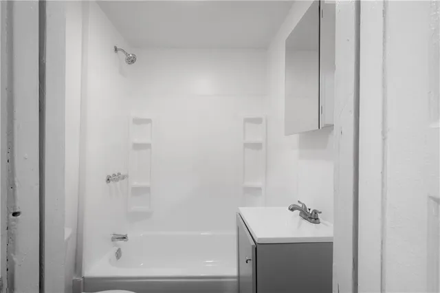 a bathroom with a sink toilet and tub