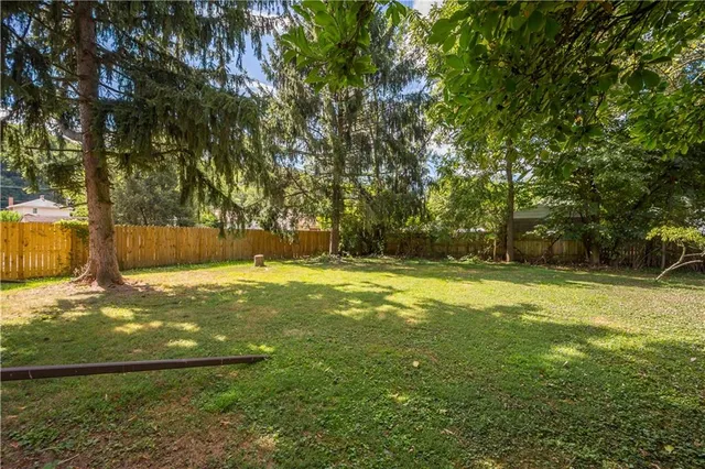 a view of swimming pool with yard