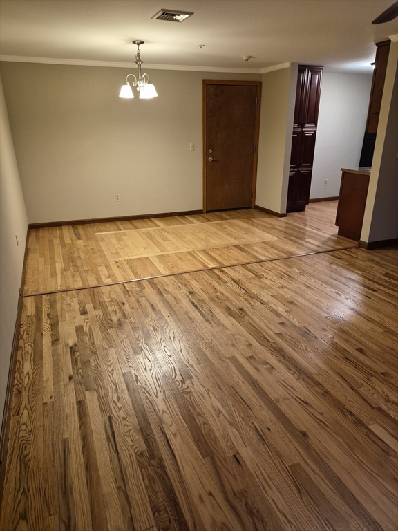 333 1st Street, Unit 209 Lowell, MA 01850 - Photo 14 of 16 a view of a room with wooden floor
