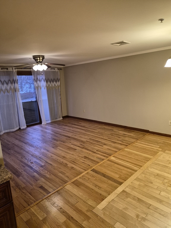 333 1st Street, Unit 209 Lowell, MA 01850 - Photo 15 of 16 a view of a room with a wooden floor