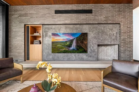 a living room with furniture and flat screen tv