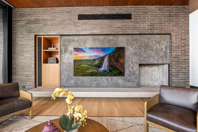 a living room with furniture and flat screen tv