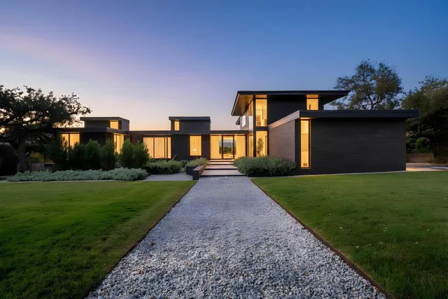 a front view of a house with garden