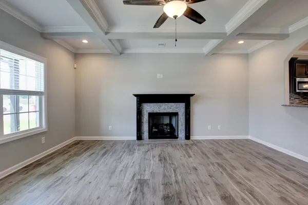 a large kitchen with kitchen island a sink appliances and cabinets
