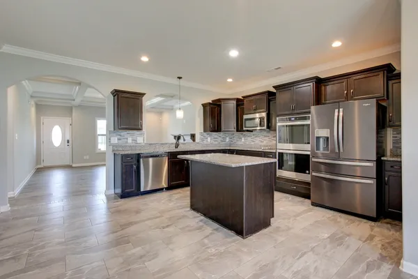 wooden floor in an empty room with a fireplace