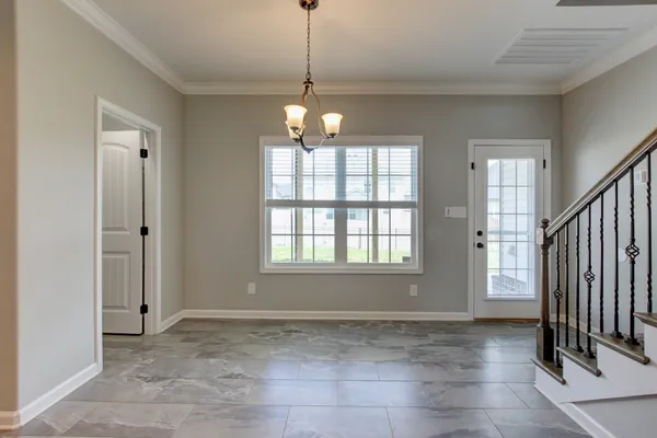 a view of a big room with wooden floor and a porch