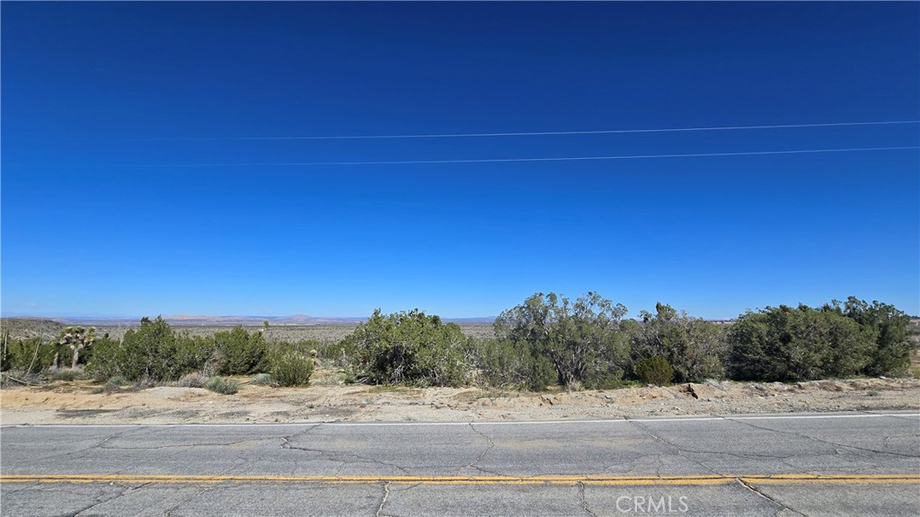 0 Valyermo Road Pearblossom, CA 93553 - Photo 11 of 35 a view of a road with sunset