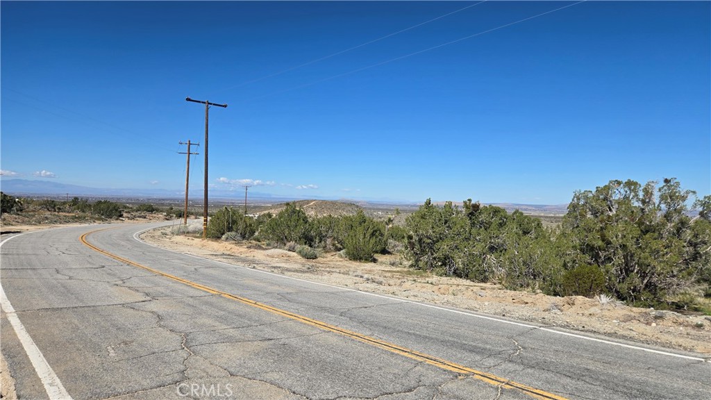 0 Valyermo Road Pearblossom, CA 93553 - Photo 12 of 35 a view of a road with a building in the background