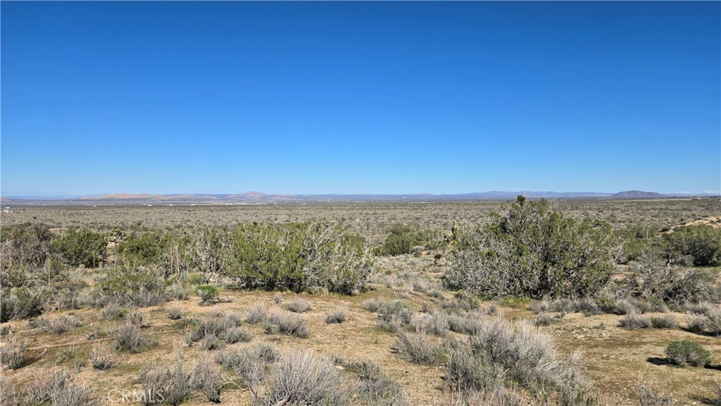 0 Valyermo Road Pearblossom, CA 93553 - Photo 21 of 35 a view of a large body of water with a building in back