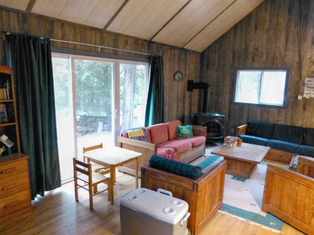 557 Phinney Farm Road Lincoln, ME 04457 - Photo 16 of 32 Living area with sliding glass doors.