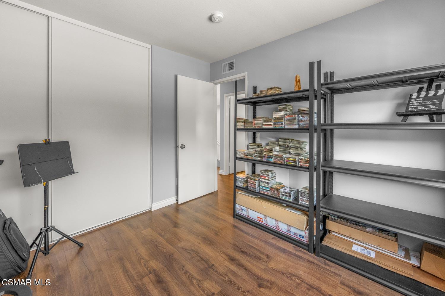 1741 Chaps Court Simi Valley, CA 93063 - Photo 19 of 28 a view of an empty room with wooden floor and a window
