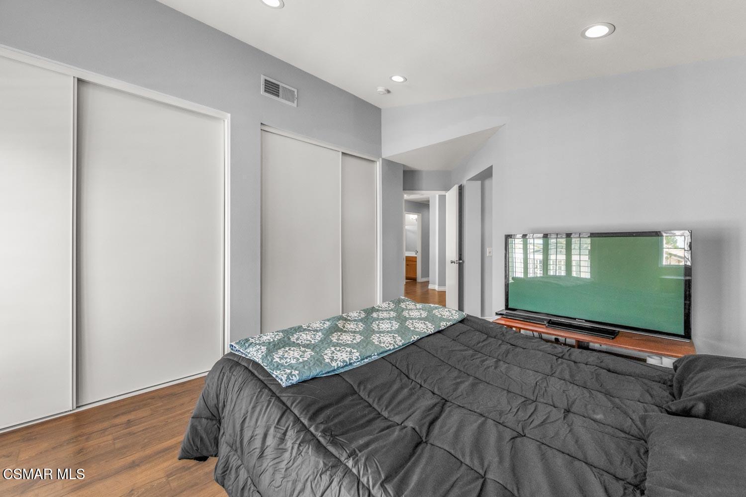 1741 Chaps Court Simi Valley, CA 93063 - Photo 21 of 28 a bedroom with a bed next to a window