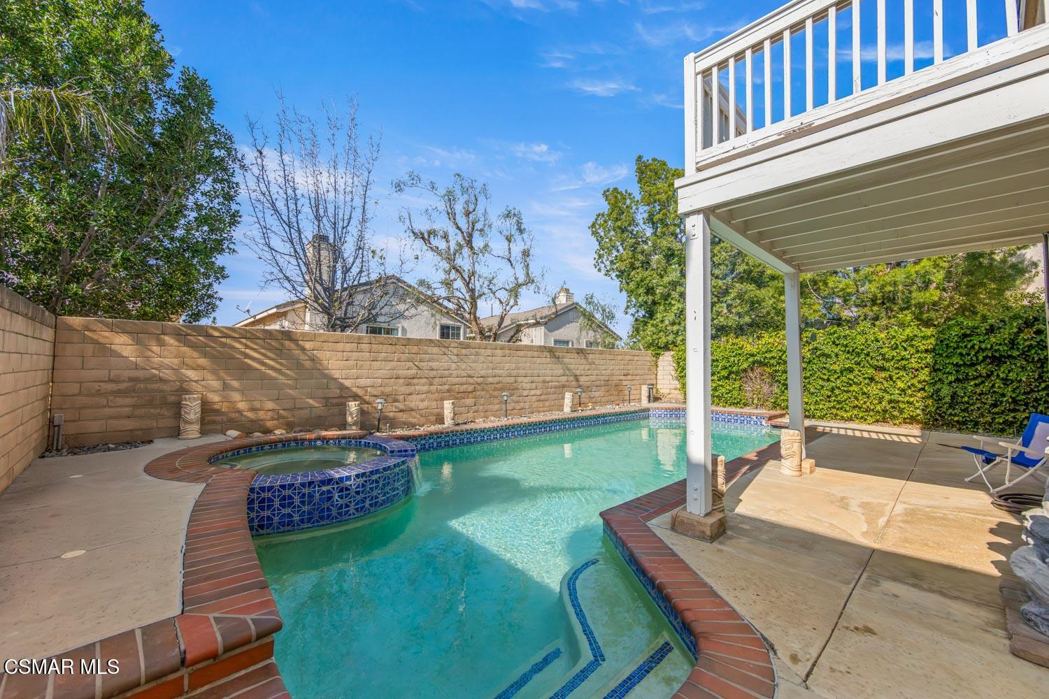 1741 Chaps Court Simi Valley, CA 93063 - Photo 26 of 28 a view of a backyard with plants and a patio
