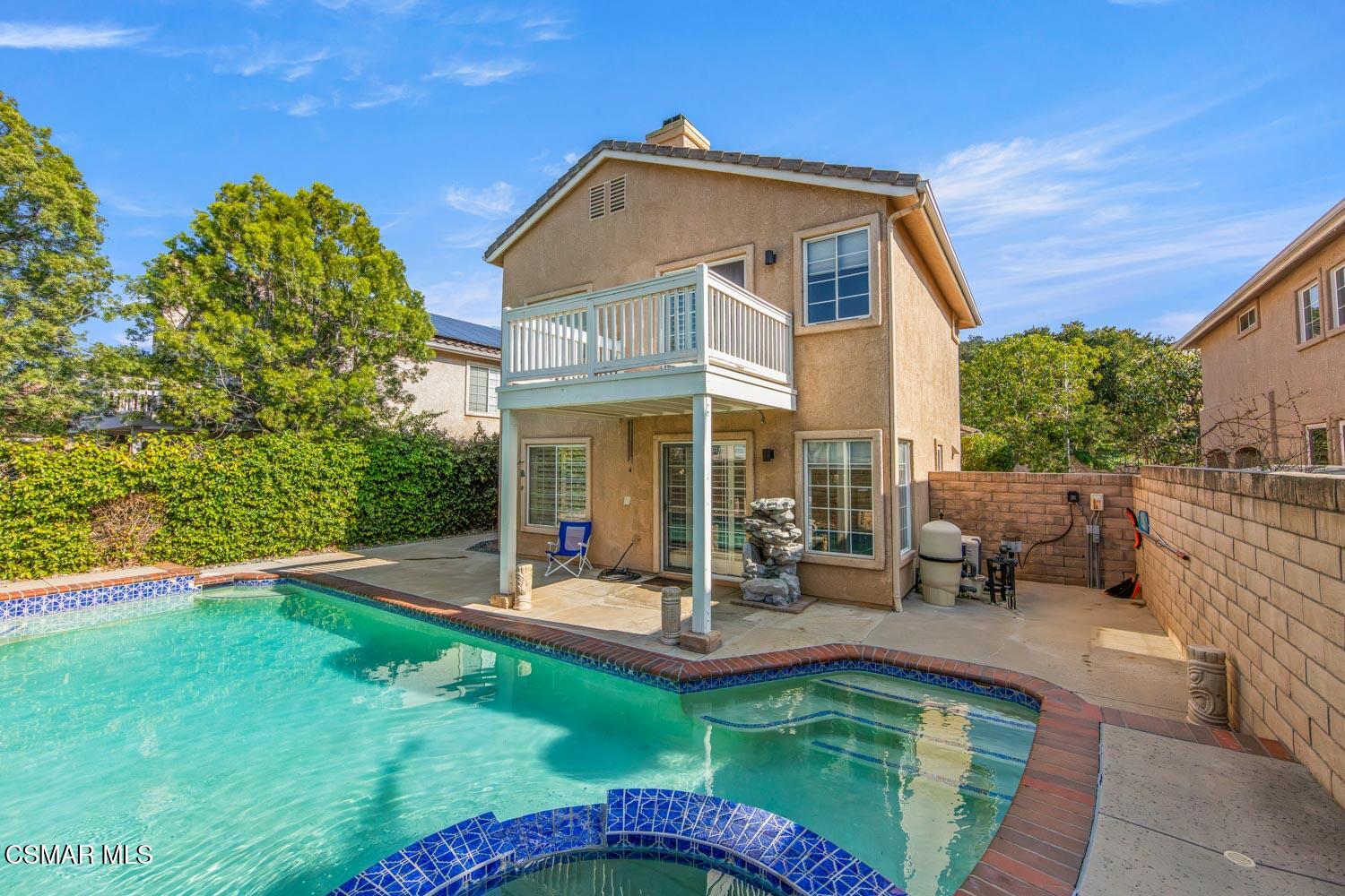 1741 Chaps Court Simi Valley, CA 93063 - Photo 27 of 28 a view of a house with swimming pool and sitting area