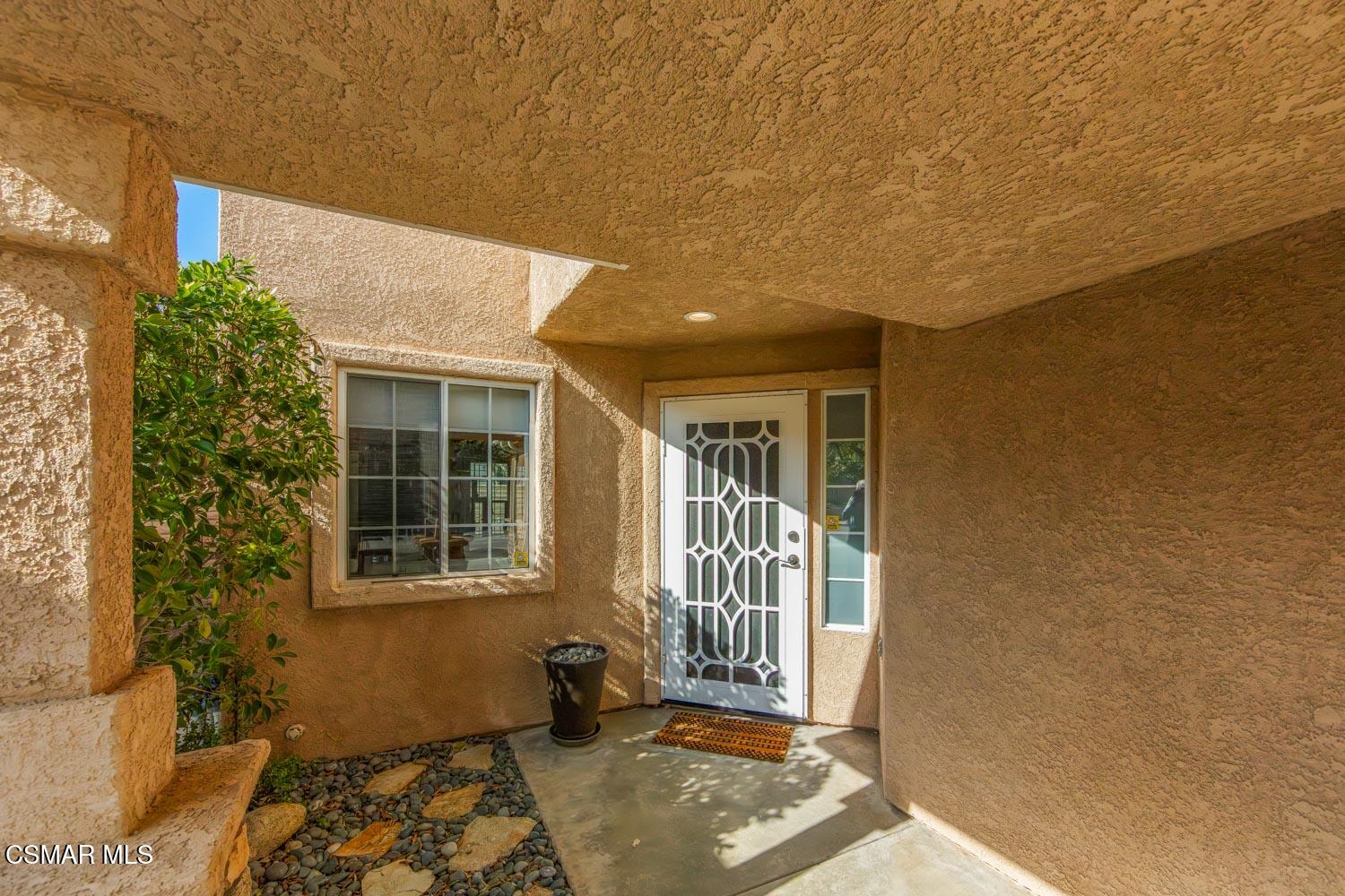 1741 Chaps Court Simi Valley, CA 93063 - Photo 3 of 28 a view of a house with a black and white door