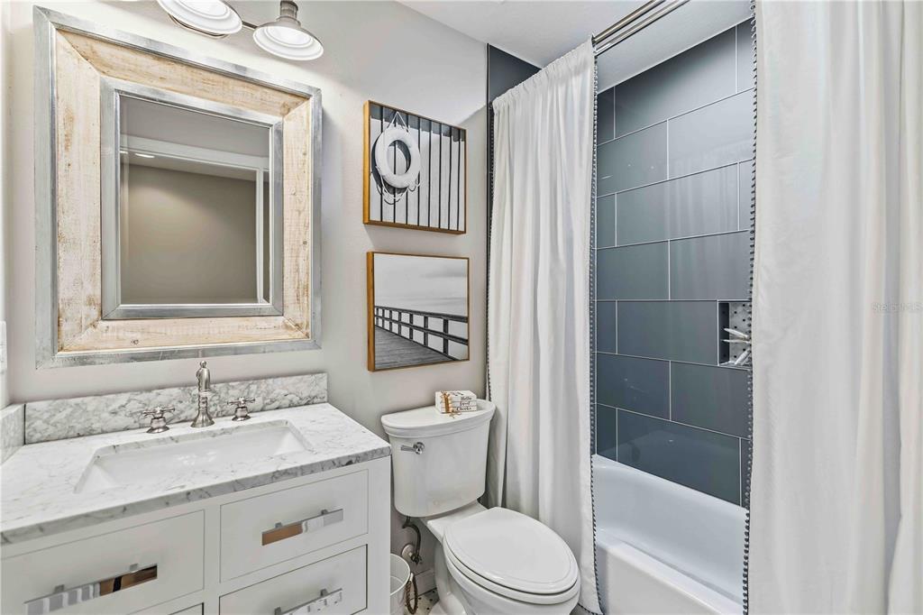 9040 White Sage Loop Lakewood Ranch, FL 34202 - Photo 22 of 59 a bathroom with a sink a toilet and shower