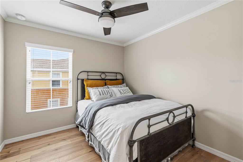 9040 White Sage Loop Lakewood Ranch, FL 34202 - Photo 23 of 59 a bedroom with a bed and a window