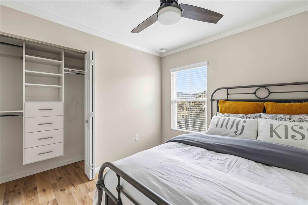 9040 White Sage Loop Lakewood Ranch, FL 34202 - Photo 24 of 59 a bedroom with a large bed and a window