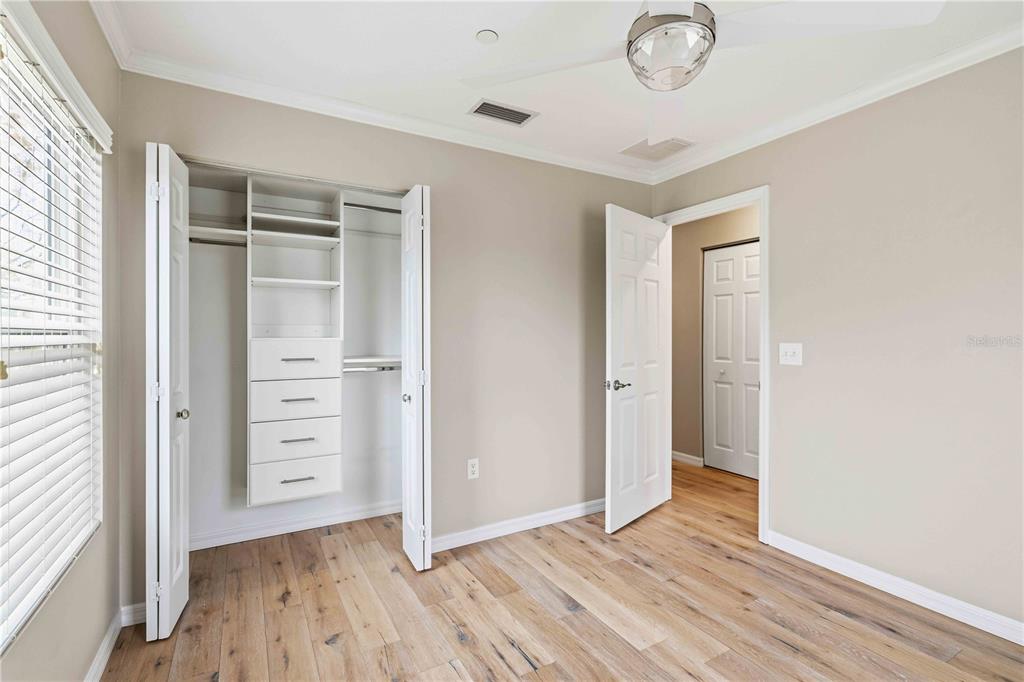 9040 White Sage Loop Lakewood Ranch, FL 34202 - Photo 26 of 59 wooden floor in an empty room