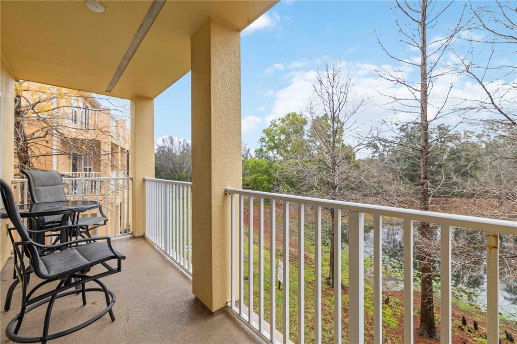 9040 White Sage Loop Lakewood Ranch, FL 34202 - Photo 31 of 59 a view of a balcony with chair and table