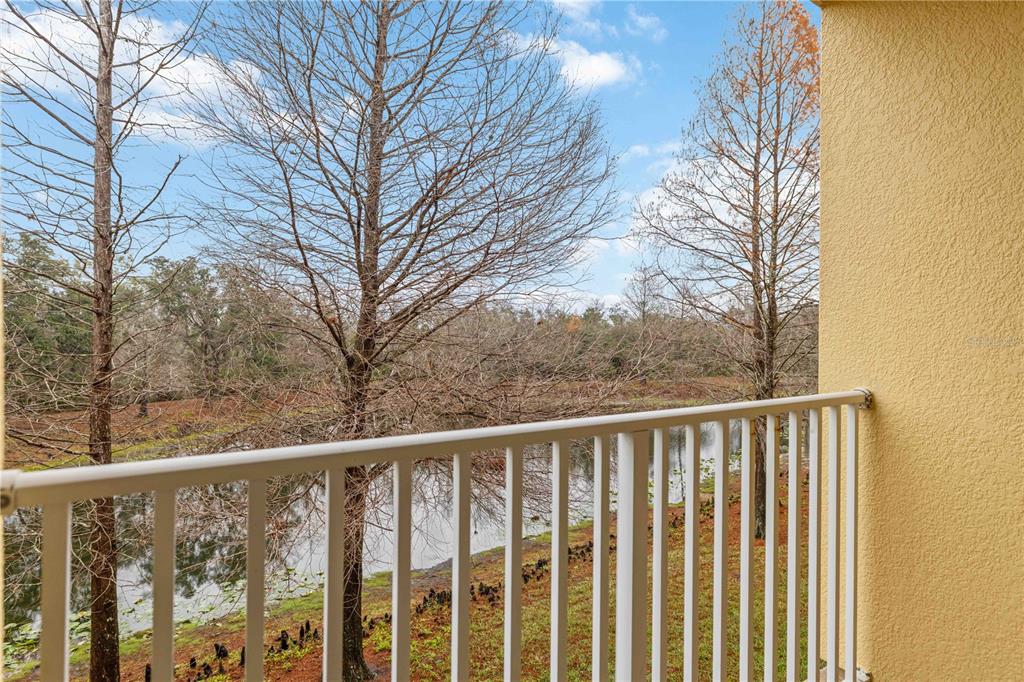9040 White Sage Loop Lakewood Ranch, FL 34202 - Photo 32 of 59 a view of a wooden fence and trees