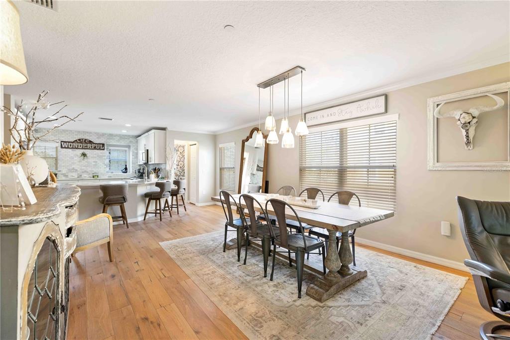 9040 White Sage Loop Lakewood Ranch, FL 34202 - Photo 36 of 59 a view of a a dining room with furniture window and wooden floor